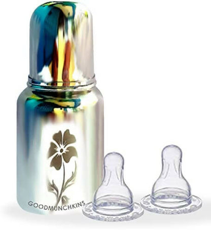 Metallic baby bottle with floral design and two clear nipples on a white background