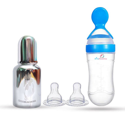 Baby bottles with different nipples on a white background