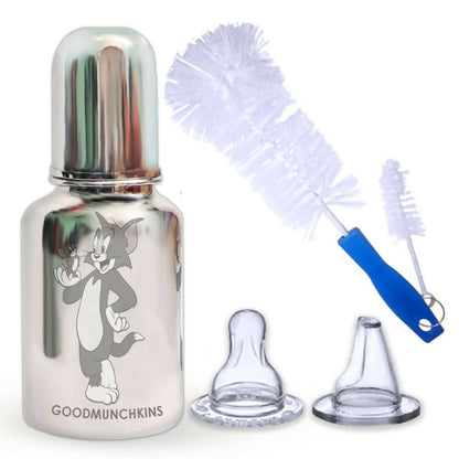 Bottle with cartoon character, bottle brush, and caps on a white background