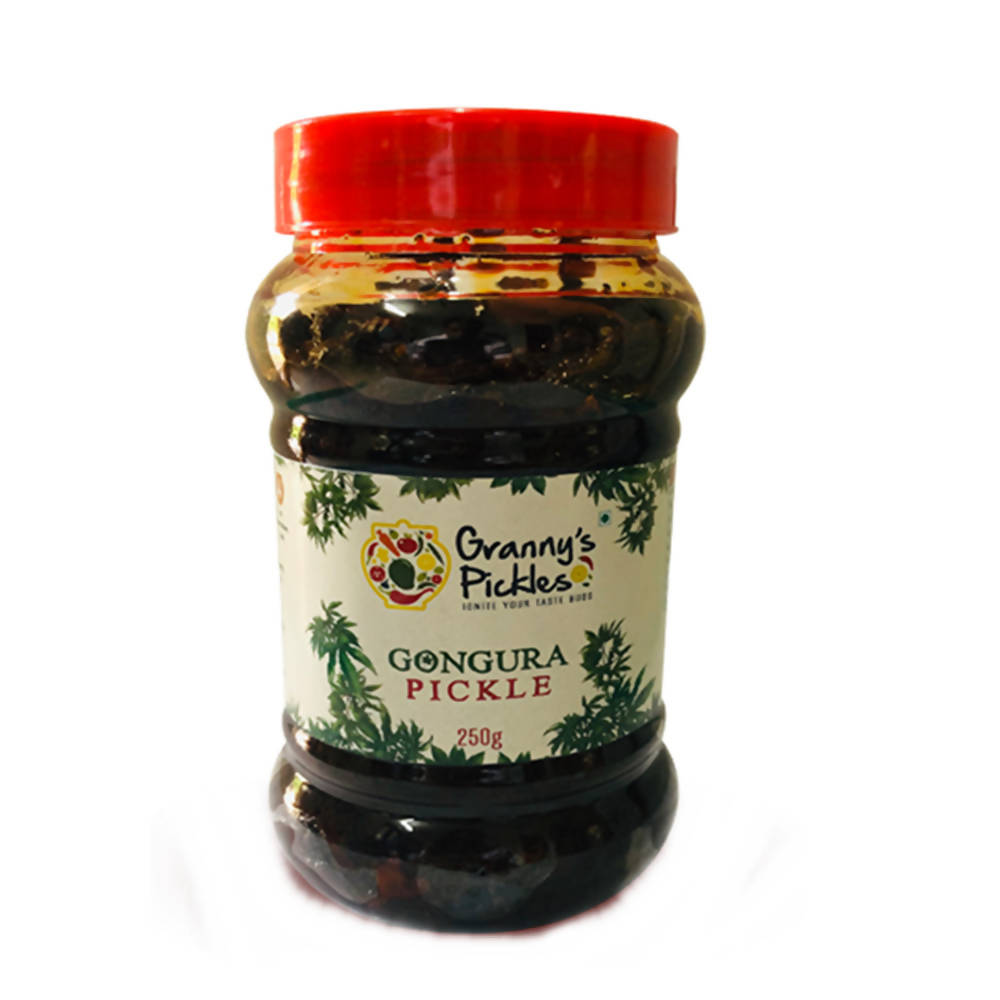 Jar of Gongura Pickle with a red lid on a white background