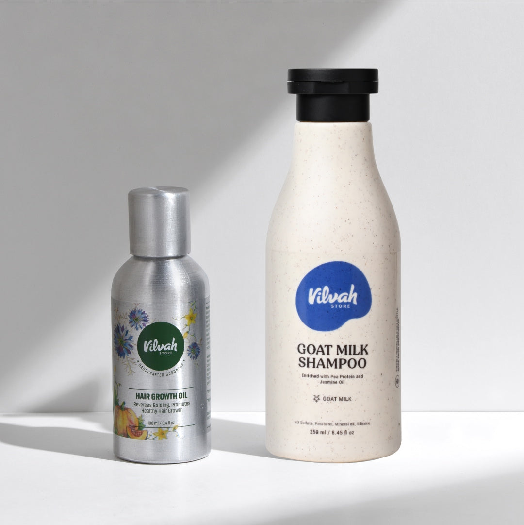 Two bottles of Vilvah products on a light gray background