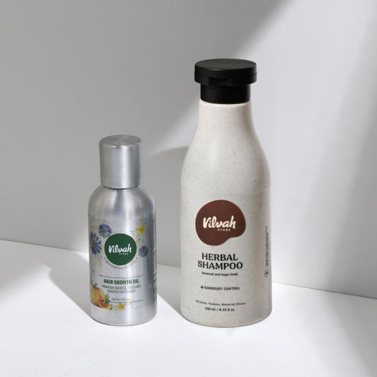 Two Vilvah products, a silver bottle and a white bottle with a black cap, on a light background.