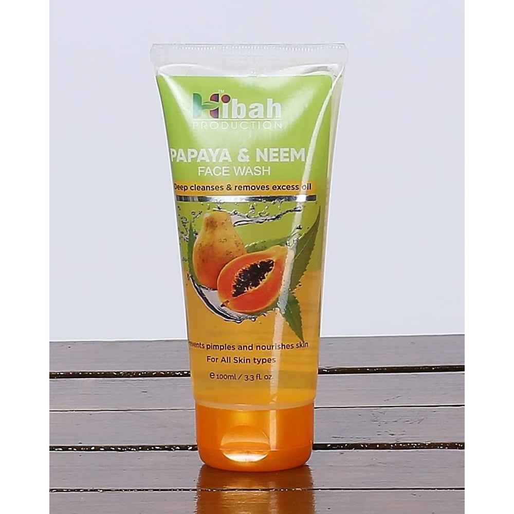 Tube of Hiibab Papaya & Neem Face Wash on a wooden surface with a light gray background