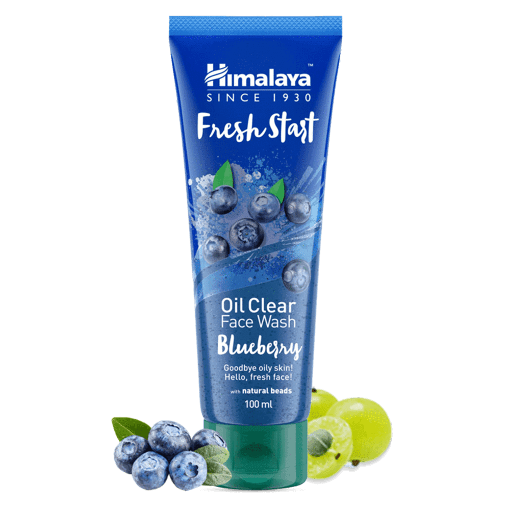 Himalaya Fresh Start Oil Clear Face Wash Blueberry tube with blueberries and green leaves on a black background