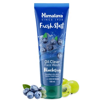 Himalaya Fresh Start Oil Clear Face Wash Blueberry tube with blueberries and green leaves on a black background