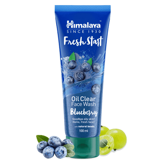 Himalaya Fresh Start Oil Clear Face Wash Blueberry tube with blueberries and green leaves on a black background