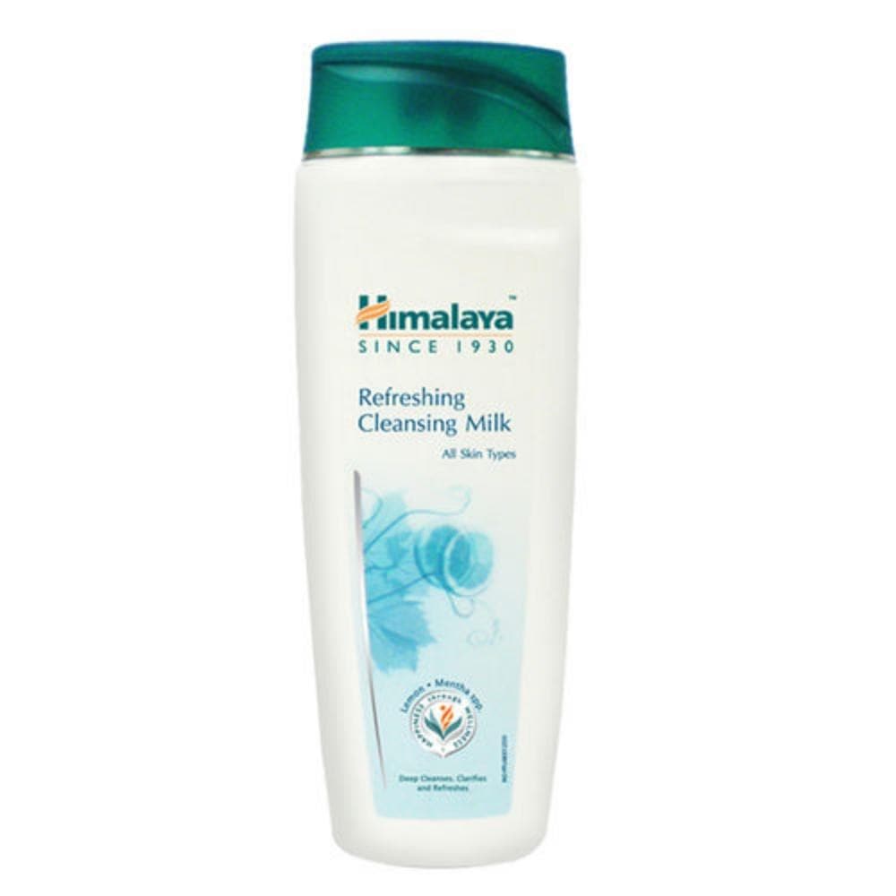 A bottle of Himalaya Herbals Refreshing Cleansing Milk with a white body and green cap. The label features the brand name, product name, and an image of a face with clear skin.