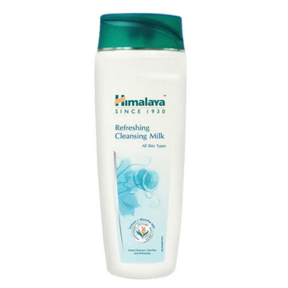 A bottle of Himalaya Herbals Refreshing Cleansing Milk with a white body and green cap. The label features the brand name, product name, and an image of a face with clear skin.
