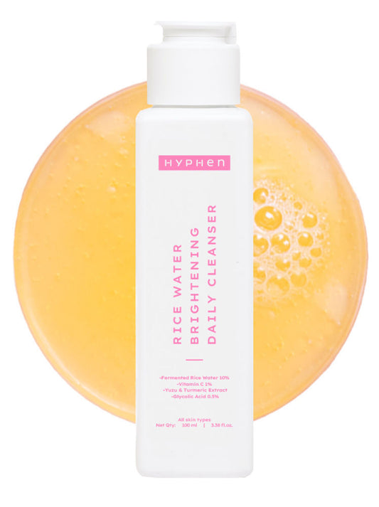 Hyphen rice water brightening daily cleanser with a yellow soap bar on a white background