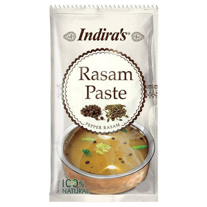Indira's Rasam Paste packaging with a bowl of rasam on a white background