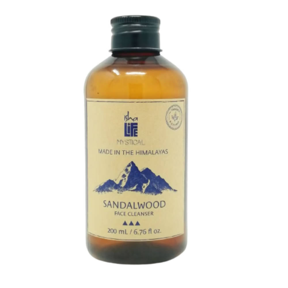 Bottle of sandalwood face cleanser with mountain design on label against a white background