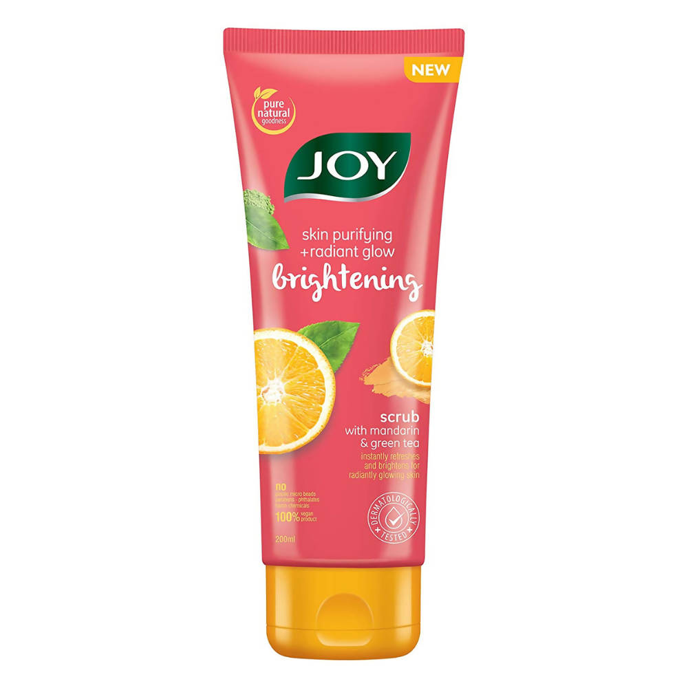 Joy brightening scrub tube with mandarin and green tea on a white background