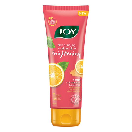 Joy brightening scrub tube with mandarin and green tea on a white background