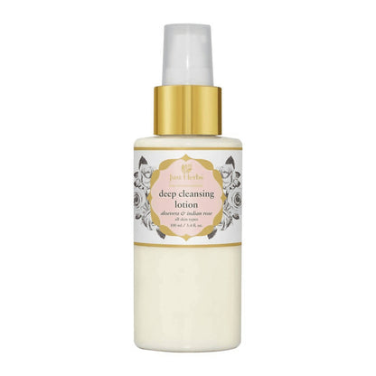 White bottle of deep cleansing lotion with gold cap on a white background