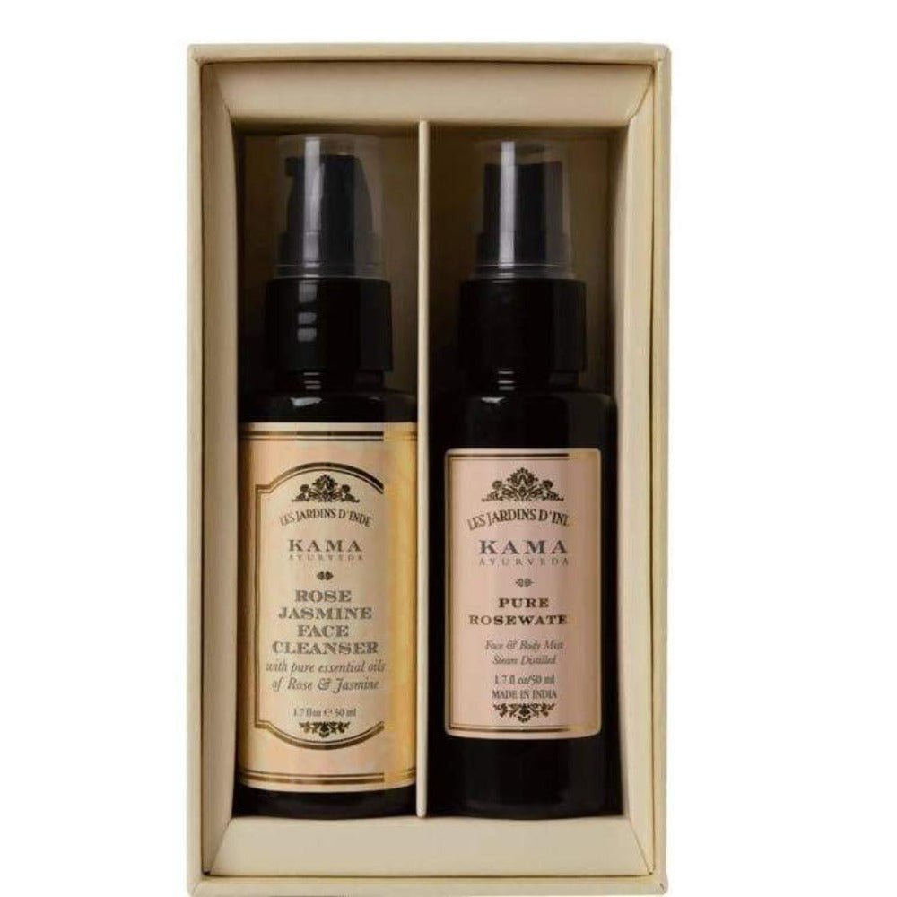 Two Kama Ayurveda skincare products in a wooden box on a white background