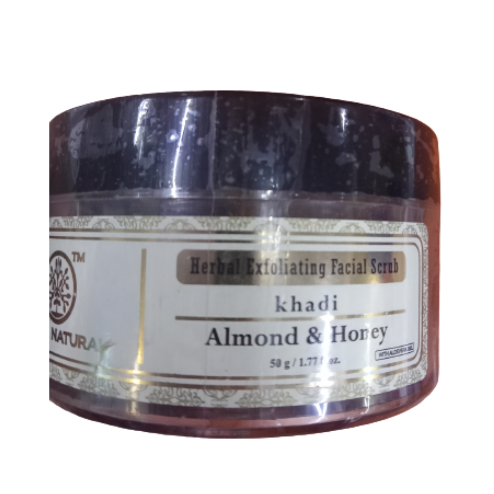 Jar of Herbal Exfoliating Facial Scrub with Almond & Honey by khadi on a white background