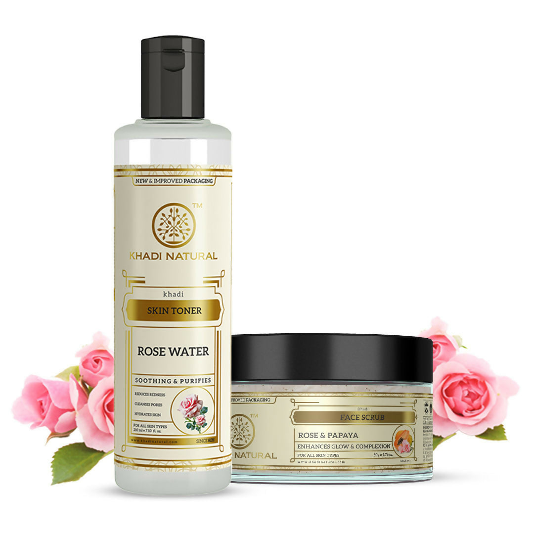 Khadi Natural skincare products with rose water toner and scrub on a white background with pink roses.