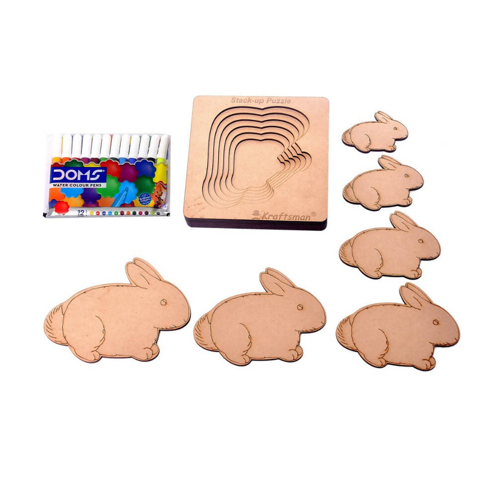 Wooden rabbit mold and stamps with color samples on a white background