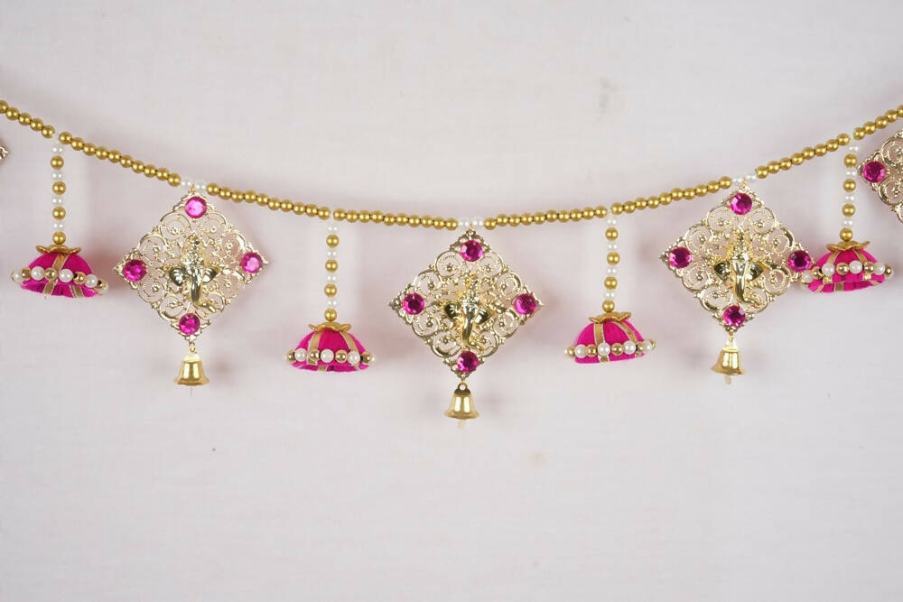 Decorative necklace with gold and pink elements on a white background