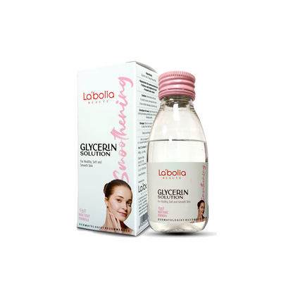 A bottle of Labolia Beaute Glycerin Solution with its packaging box. The bottle is transparent, revealing a clear liquid inside, with a pink cap.