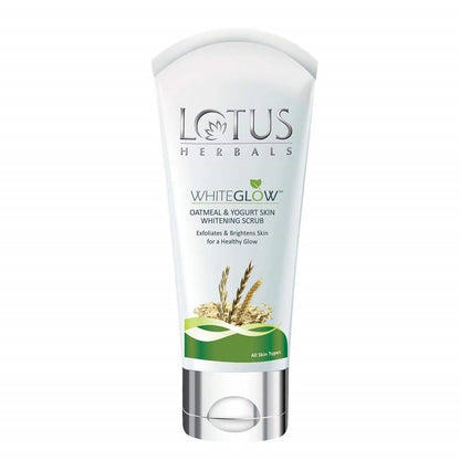 A tube of Lotus Herbals White Glow Oatmeal And Yogurt Skin Whitening Scrub with green accents on the packaging.
