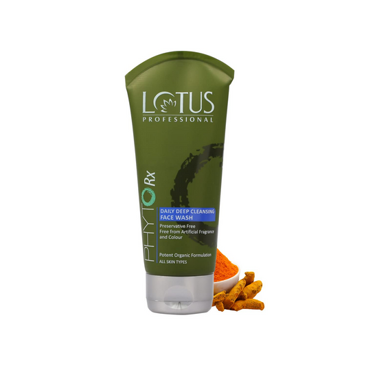 Green tube of Lotus Professional face wash with turmeric and a bowl on a white background