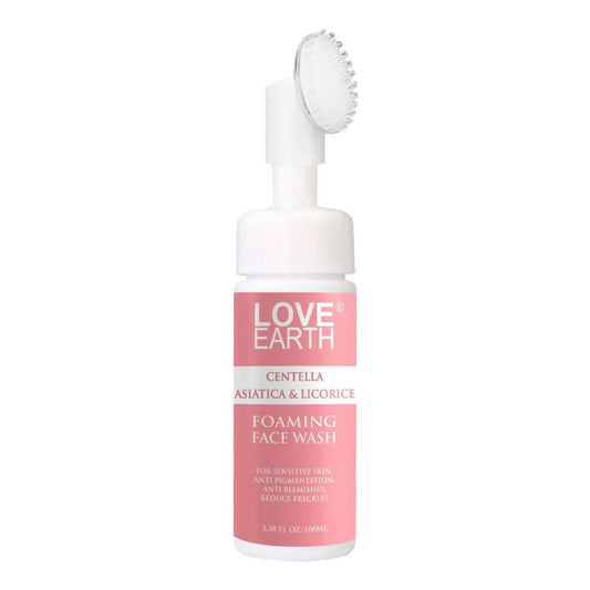 Love Earth foaming face wash bottle with brush on a white background