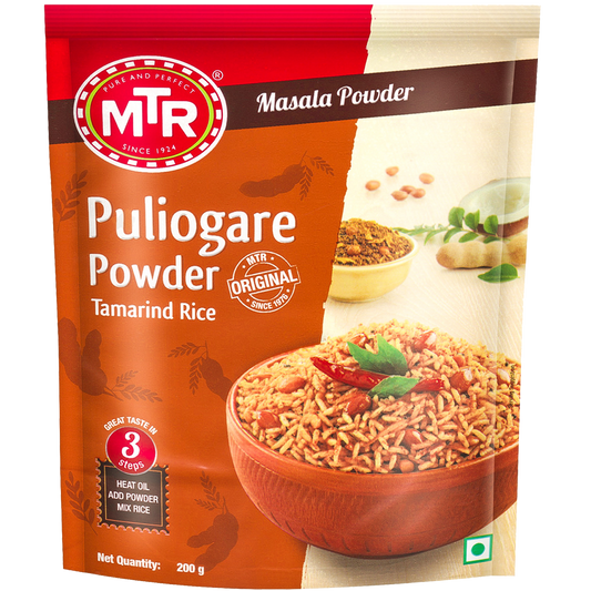 MTR Puliyogare Powder packaging with a bowl of rice and ingredients on a white background