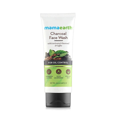A bottle of Mamaearth Charcoal Face Wash for oil control, with active charcoal and coffee mentioned on the label.