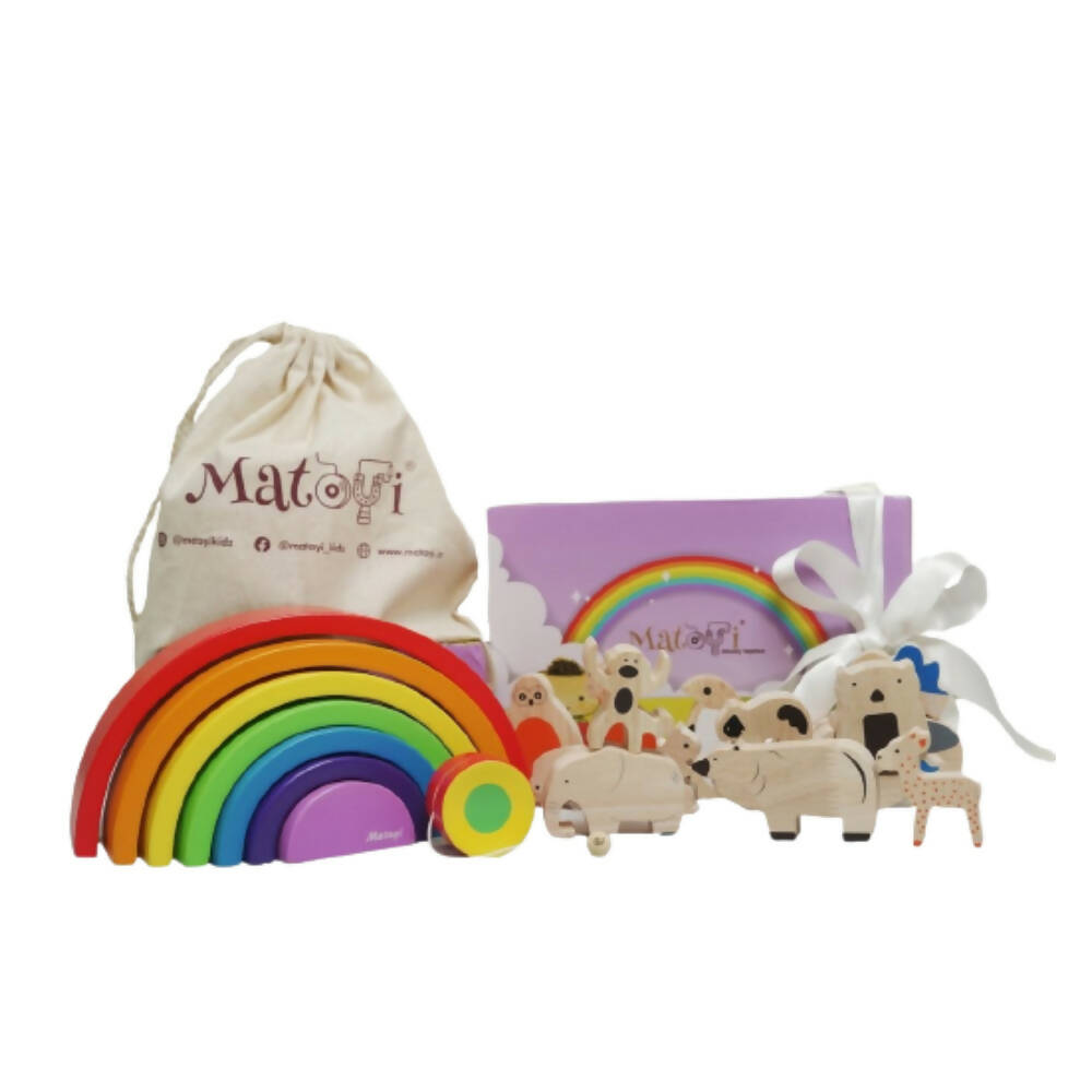 Set of wooden toys including a rainbow and animal figures, with a branded drawstring bag and packaging on a white background.