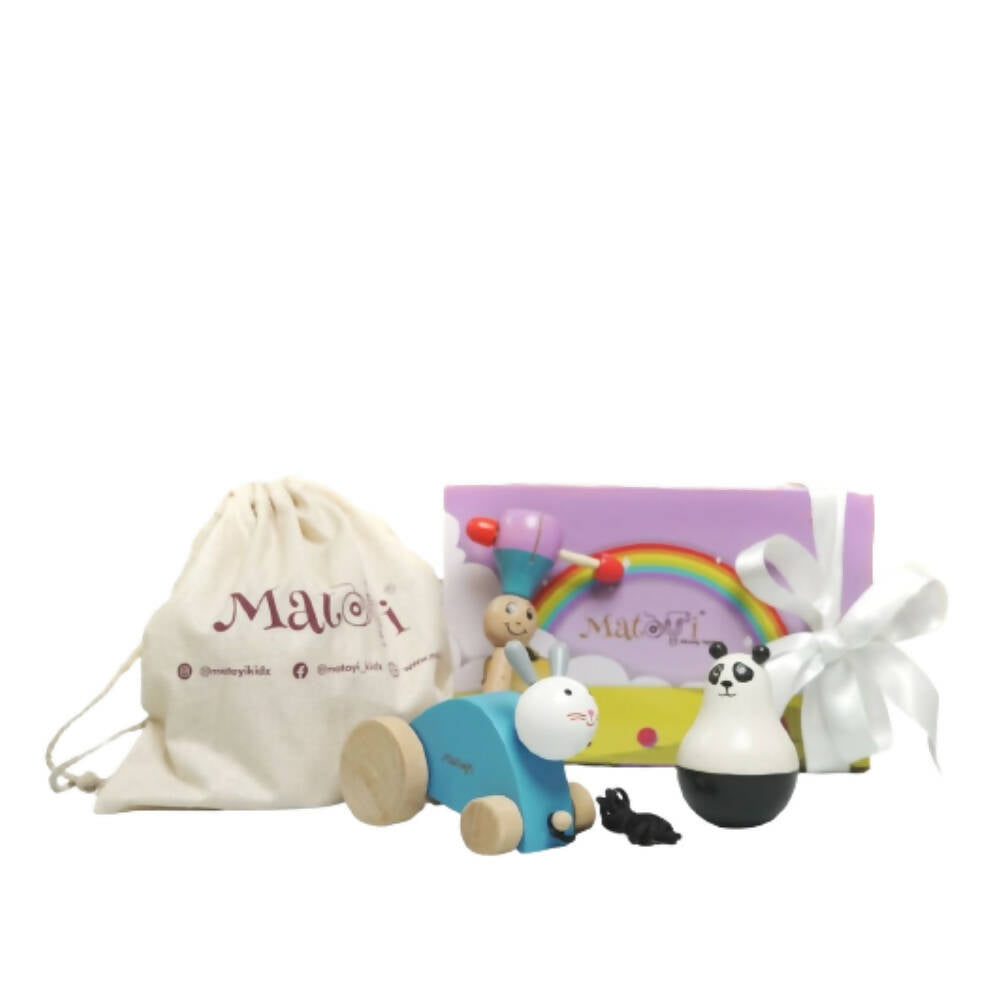 Set of wooden toys with a drawstring bag and packaging on a white background