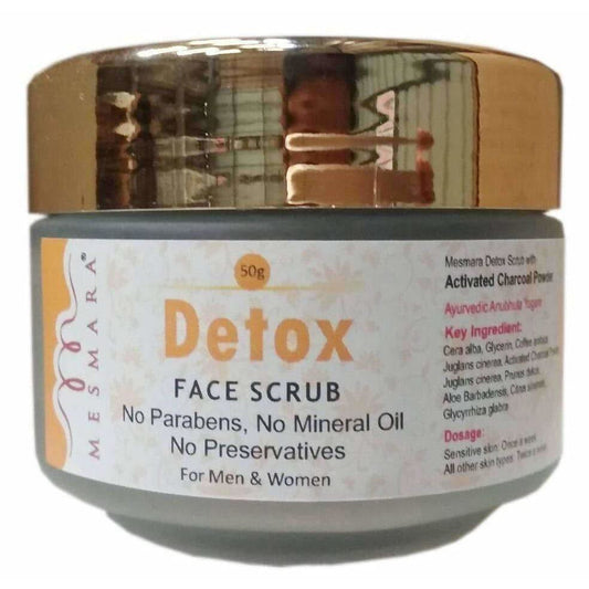 Detox face scrub jar with gold lid on a white background