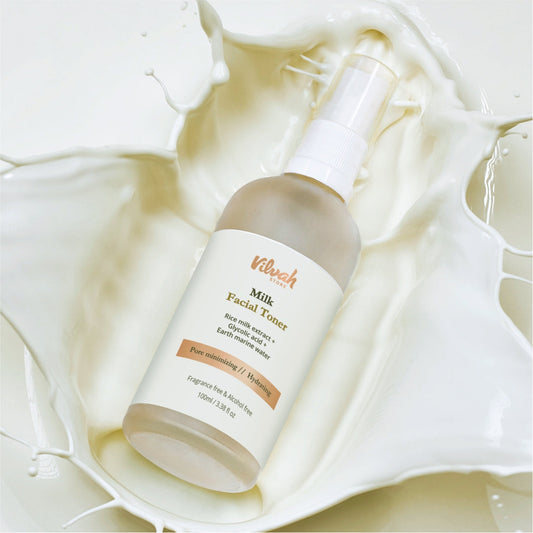 Vilvoh Milk Facial Toner bottle on a soft white fabric background