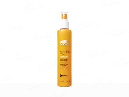 Orange spray bottle with 'milk shake' branding on a white background