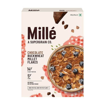 Box of Millé chocolate buckwheat millet flakes with a bowl of cereal and blueberries on a white background.