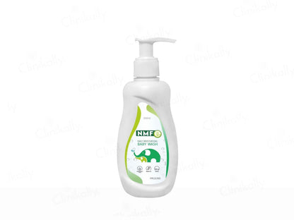 White bottle of baby wash with a pump and green label on a white background