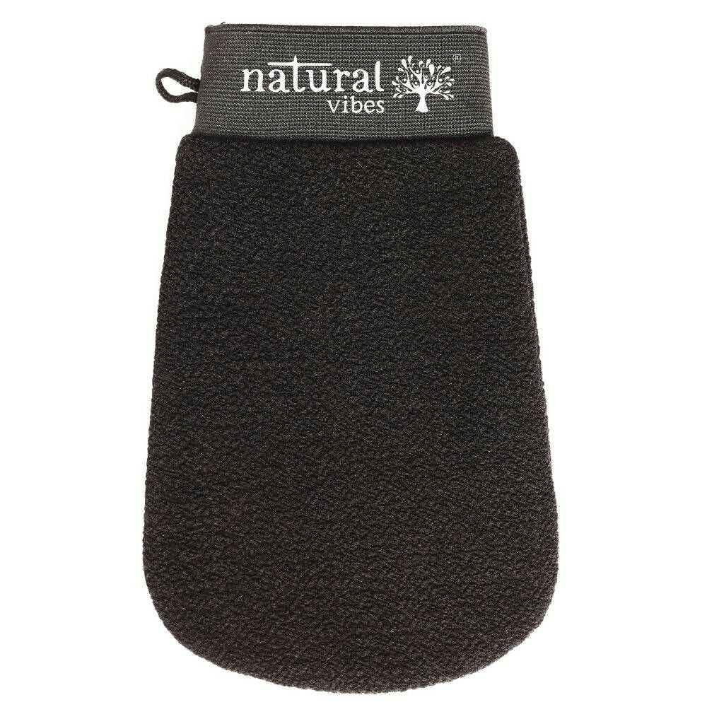 A black exfoliating and scrubbing glove with the brand 'Natural Vibes' written on the wrist area.