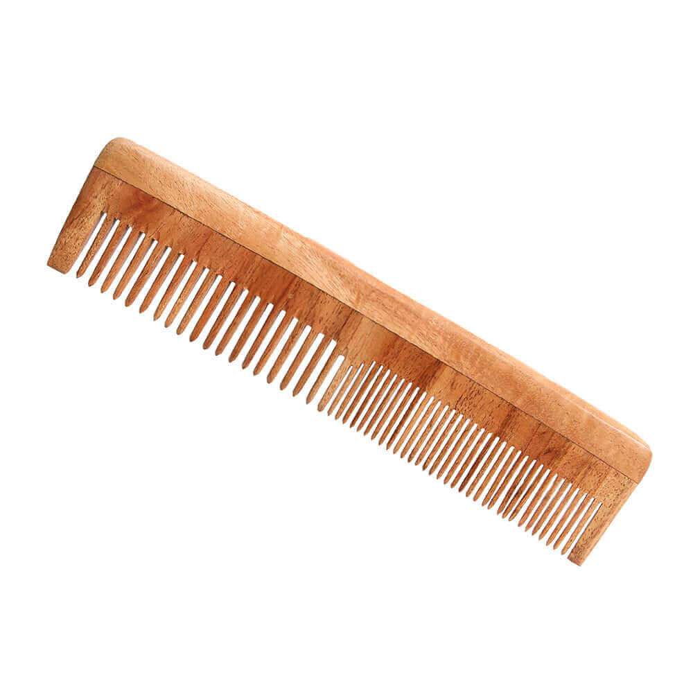 Wooden comb on a white background