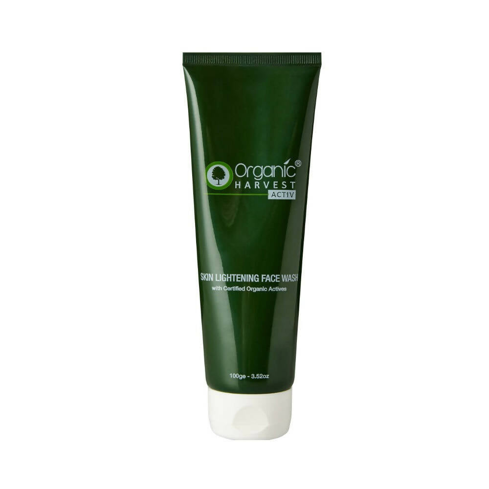 Green tube of Organic Harvest face wash on a white background