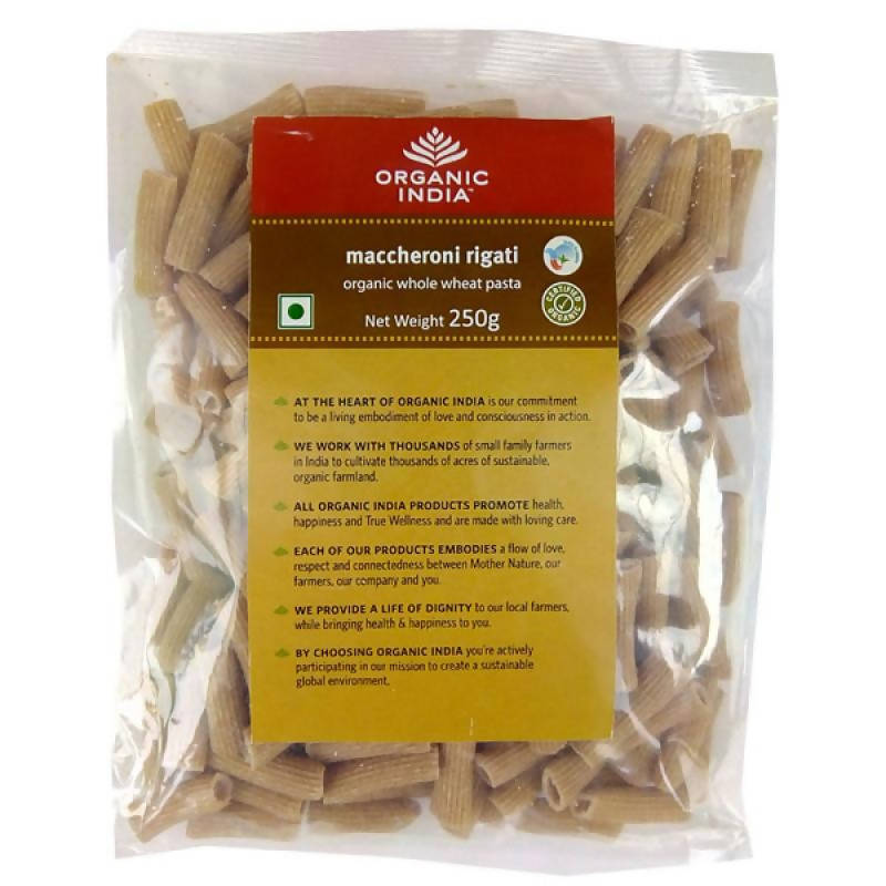 Packaged maccheroni rigati pasta with Organic India label on a white background