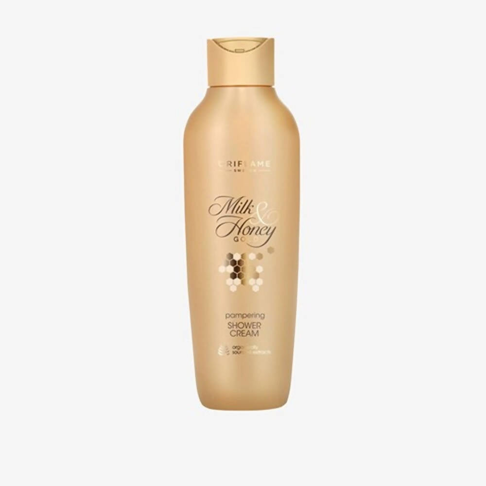 Gold bottle of Milk & Honey cream on a white background