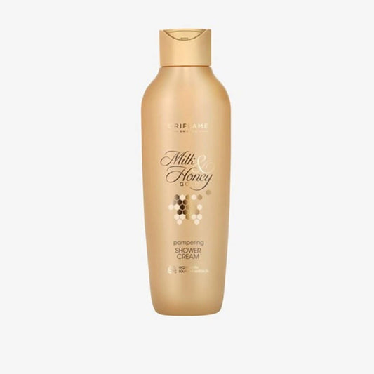 Gold bottle of Milk & Honey cream on a white background