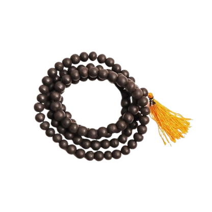 Brown beaded necklace with a yellow tassel on a white background