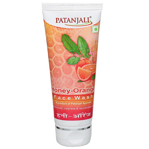Patanjali Honey Orange Face Wash in a tube with branding and imagery displaying honey and orange.