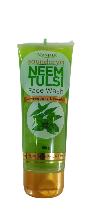 A tube of Patanjali Saundarya Neem-Tulsi Face Wash with green and white color scheme and branding information.