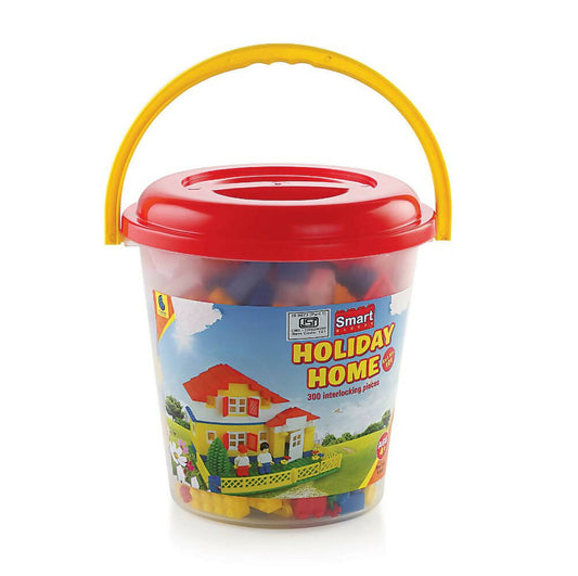 Toy building block set in a red bucket with a yellow handle on a white background