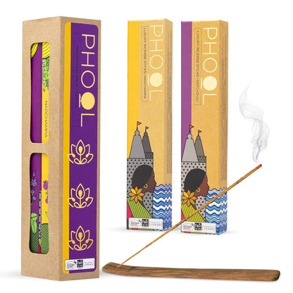 Phool Luxury Incense Sticks with one box opened to show the incense sticks inside and another with a steaming incense stick in front, set against a plain background.