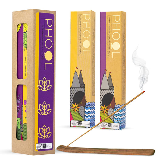 Phool Luxury Incense Sticks with one box opened to show the incense sticks inside and another with a steaming incense stick in front, set against a plain background.