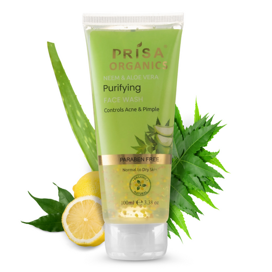 Prisa Organics Purifying Face Wash with aloe vera leaves and lemon on a white background