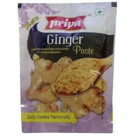 Packaging of Priya Ginger Paste with a spoonful of paste on a white background